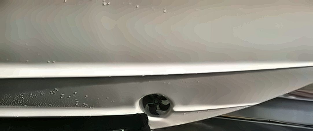 Bow thruster tunnel faired into a fiberglass hull